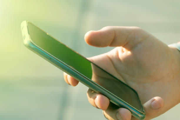 istock A man holds a phone in his hands 2166842977