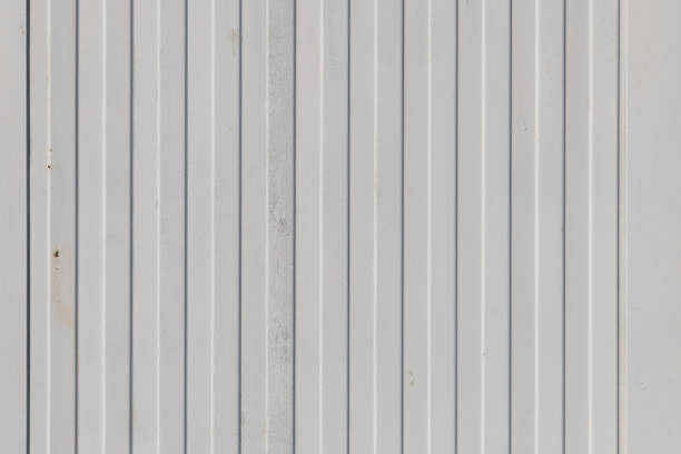 Old white painted corrugated galvanized iron. Backgrounds and textures.
