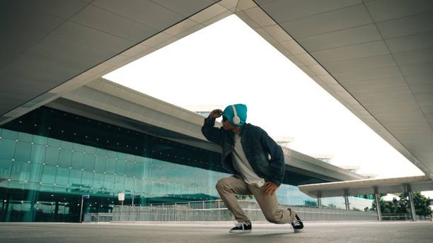 istock Happy hipster practice b boy dance with stylish cloth at building. Sprightly. 2166843843