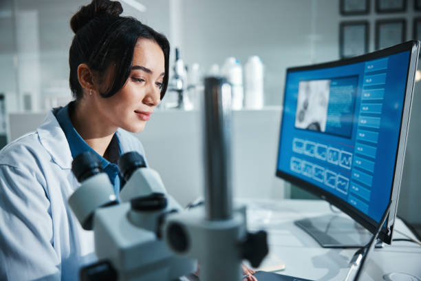 istock Computer screen, review and science with woman in laboratory for development, innovation or research. Laptop, pharmaceuticals and study with scientist at work on medical breakthrough or discovery 2166845312