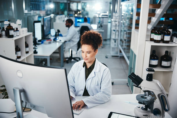 istock Computer, report and science with woman in laboratory for development, innovation or research. Desktop, pharmaceuticals and study with serious scientist at work on medical breakthrough or discovery 2166845343