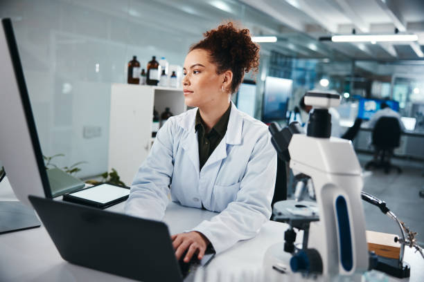 istock Concentration, laptop and science with woman in laboratory for development, innovation or research. Computer, pharmaceuticals and typing with serious scientist at work on breakthrough or discovery 2166845367
