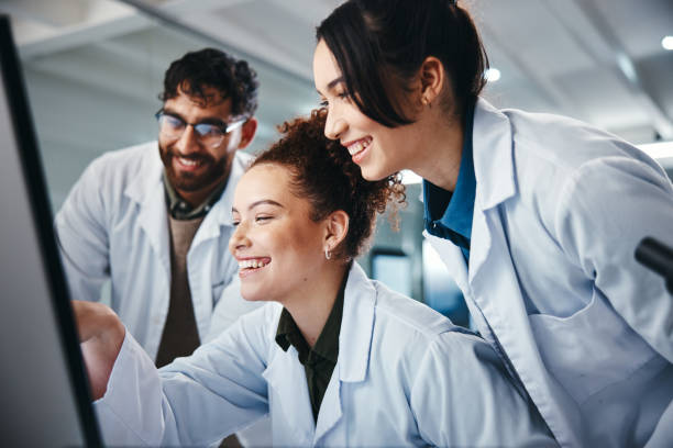 istock Science, group and computer with teamwork, research and online reading with medical cure. Employees, researchers and pc with internet, email and approval for lab funding, collaboration with expert 2166845368