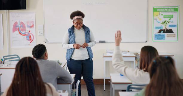 istock Teacher, question and student in college, education and preparing for exam in classroom, learning and hand. Answer, person and arm up for feedback of professor, knowledge and listening in university 2166845679