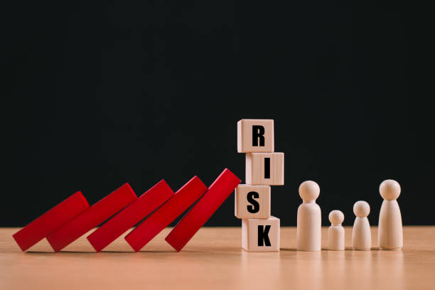 istock Risk assessment crisis concept. Financial analysis solution, real estate loan business management. Insurance technology plan protect home mortgage. House safety family life. Safe red wood domino block 2166848301
