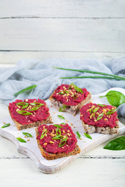 istock Toasts with beetroot, chopped nuts and herbs. Vegan bruschetta with beet 2166848686