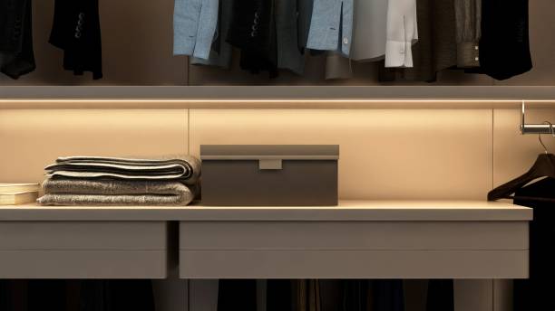 istock Space on shelf in luxury beige brown walk in closet with suits 2166848903
