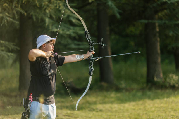 istock Teenage boy practicing archery with recurve bow on the training field 2166849968