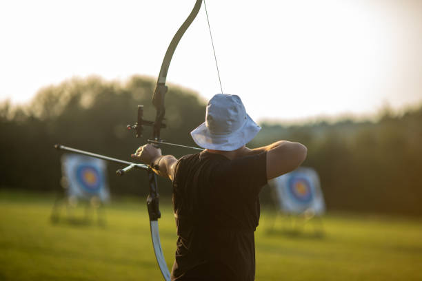 istock Teenage boy practicing archery with recurve bow on the training field 2166849986