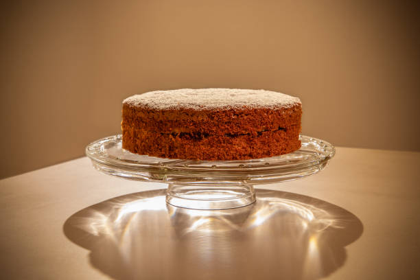 istock Classic South Tyrolean buckwheat torte (Buchweizentorte, Schwarzplententorte) filled with raspberry jam and topped with powdered sugar on a decorative glass stand 2166852478