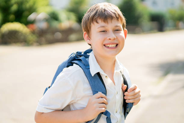 istock Back to school. Cute happy boy with backpack going to school from home. 2166853241