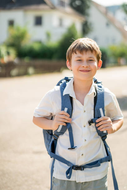 istock Back to school. Cute happy boy with backpack going to school from home. 2166853305