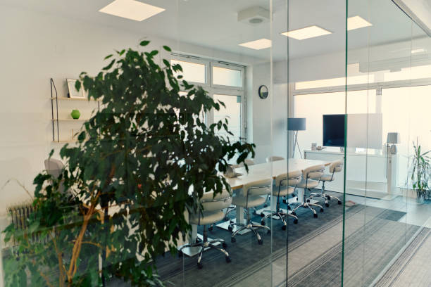istock Modern Glass Office with Chairs, Projector, and Greenery 2166856378