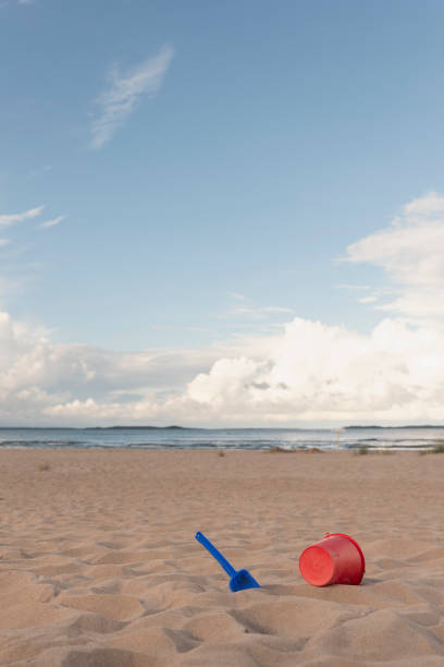 istock Shovel and bucket on the beach 2166856608