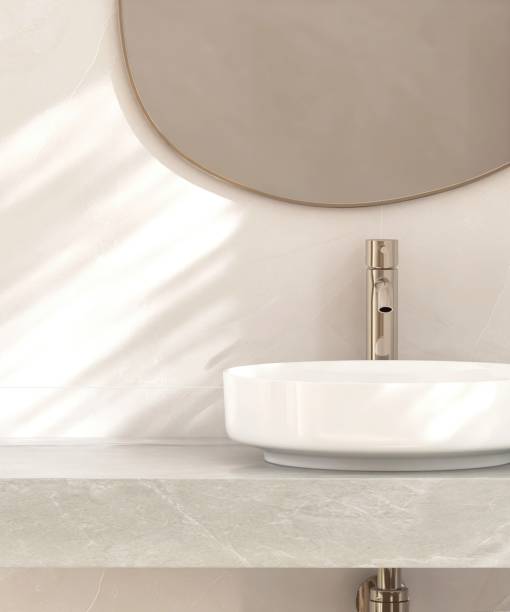 istock White round ceramic washbasin, chrome faucet, mirror on gray marble stone vanity bathroom counter 2166856738