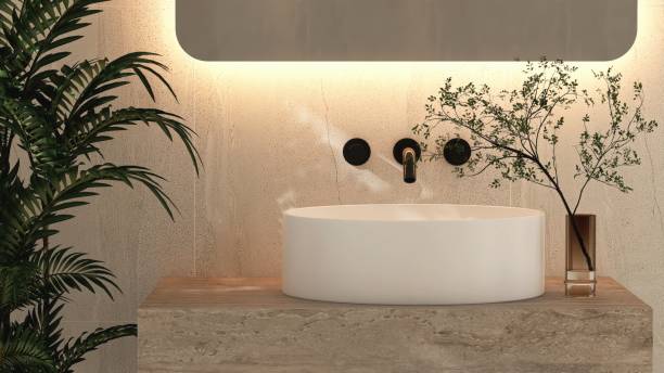 istock Round white ceramic washbasin on marble stone vanity bathroom counter, tropical tree 2166856778