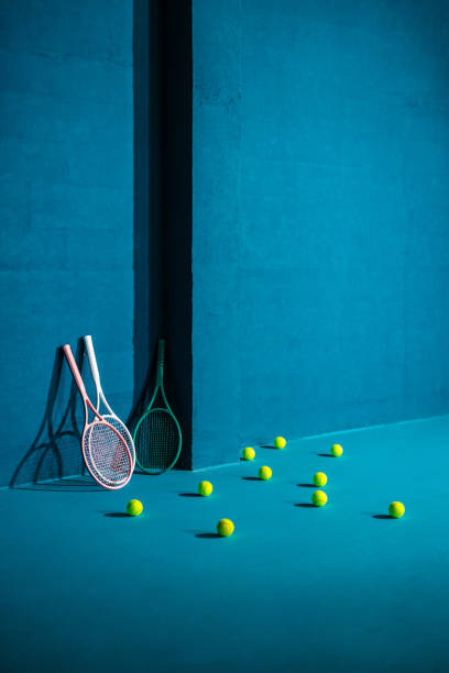istock Three racquets and tennis balls against a blue background 2166857029
