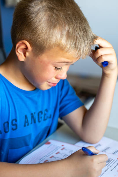 istock A boy in a blue T-shirt is crying over school 2166857041