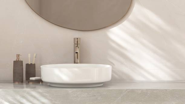 istock White round ceramic washbasin, chrome faucet, mirror on gray marble stone vanity bathroom counter 2166857111