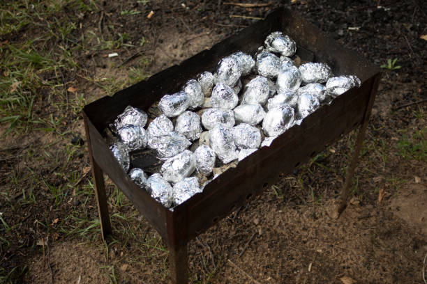 man cooking meat in barbecue grill in the party