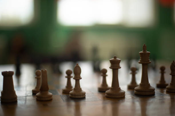 Chess pieces on table. Chess Tournament. Ancient Strategy. Game figures made of wood.