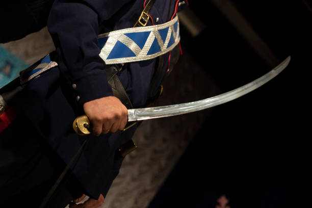 istock Melee weapon in hand. Cossack holding saber. Sword Blade. 2166859797