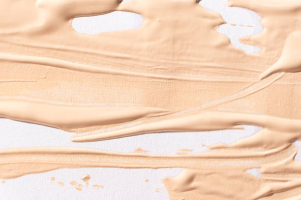 istock Abstract delicate minimalist beige background, cosmetic cream stroke on white. 2166860391