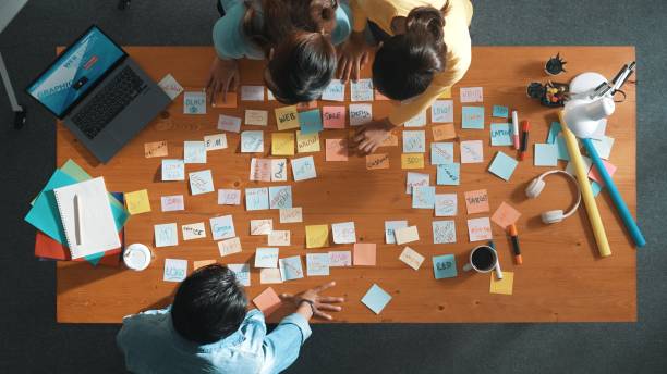 istock Top view of manager looking idea on sticky notes and explain idea. Symposium. 2166862570