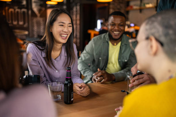 istock Group of friends talking in a pub 2166863397