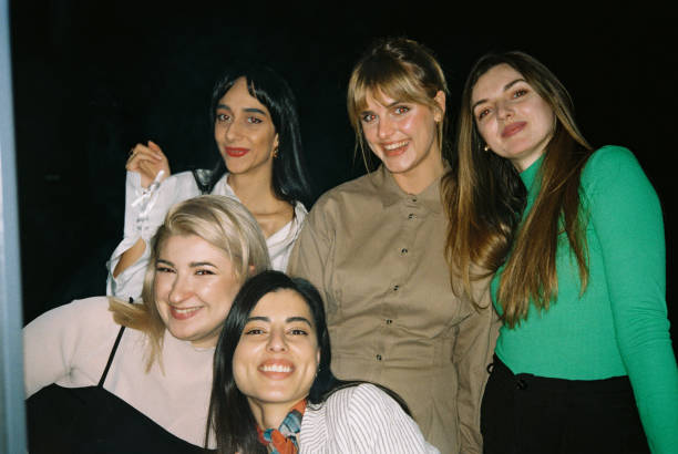 istock Portrait of five smiling friends having fun 2166865076