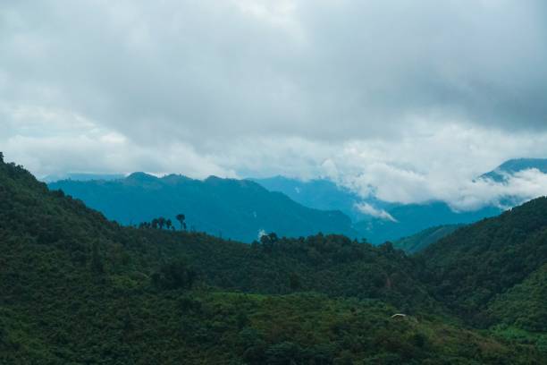 istock The mountains are covered in trees and the sky is cloudy 2166865408