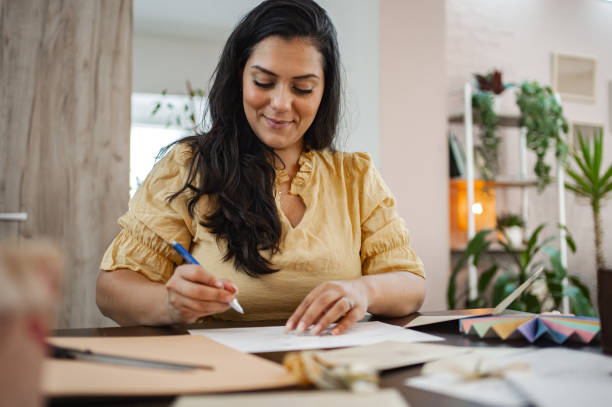 istock Woman creating art and design in bright indoor workspace during daytime 2166866021