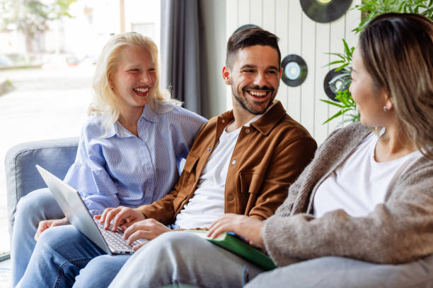 istock Group of friends enjoying time in a modern co-working space 2166869057
