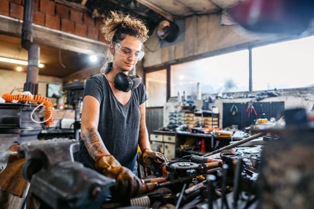 istock Young Woman Working With Metal In A Metal Workshop 2166870043
