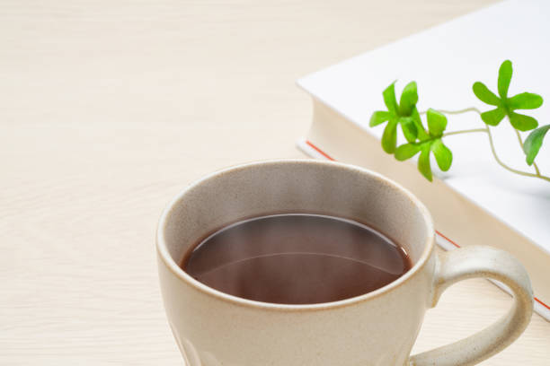 A close-up photograph of a cup of coffee.
