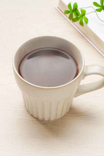 istock Hot cocoa isolated on wooden table 2166870133