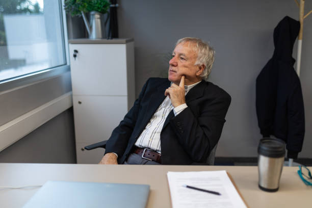 istock Senior businessman working in an office 2166870370