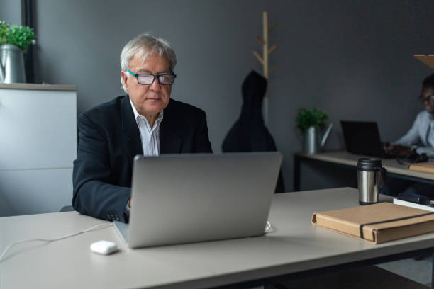 istock Senior businessman working in an office 2166870808