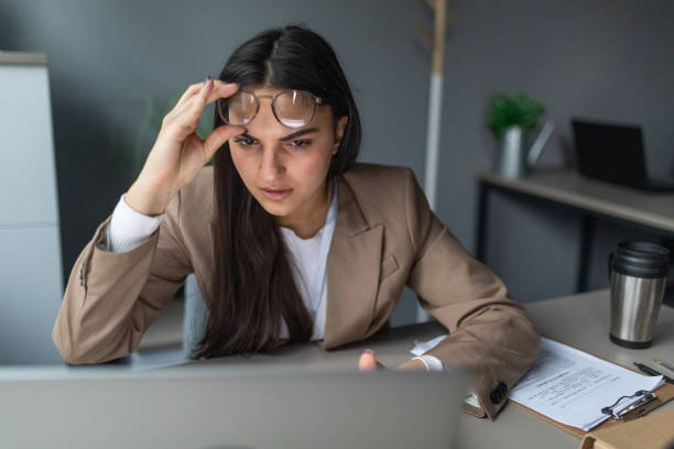 istock Young woman frustrated at work 2166871136