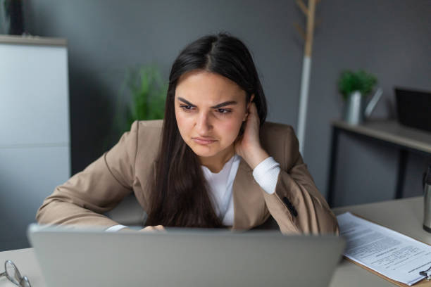 istock Young woman frustrated at work 2166871174