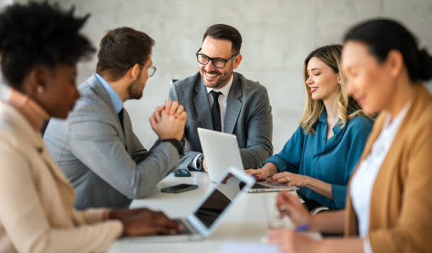 istock Multicultural professional businesspeople working together on research plan in boardroom. 2166871236