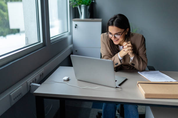 istock Young woman working in an office 2166871491