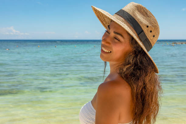 istock Woman at the beach 2166872595