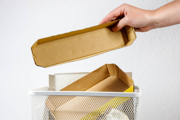 trash can with cardboard. sorting trash. paper and cardboard.