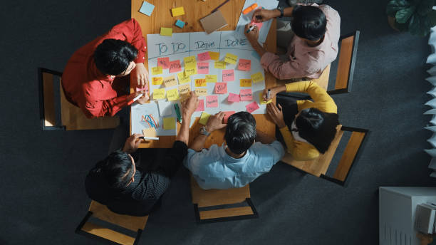istock Top view of diverse people writing and making scrum task board. Convocation. 2166874186