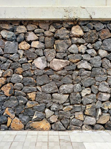 istock Background of stone wall texture. Old texture of granite stone wall surface. 2166875785