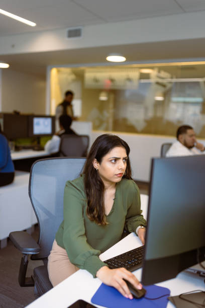 istock Busy Office Environment with Focused Employees 2166876767
