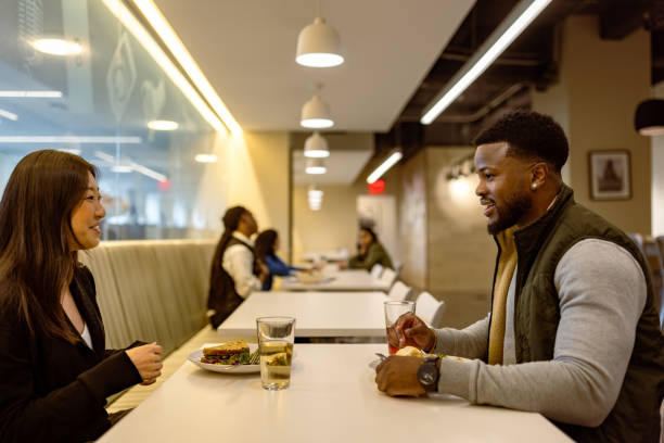 istock Lunch Meeting in Modern Cafeteria 2166876792