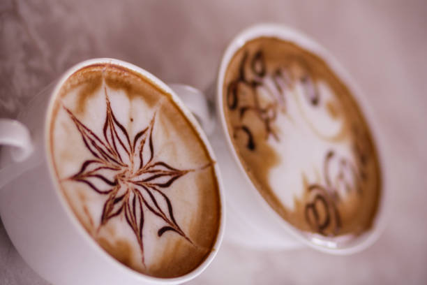 Cappuccino in a white cup on a white saucer. Still-life on a white background.