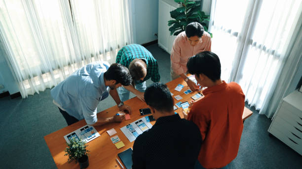 istock Top view of team working together to compare and plan UX Ui design. Convocation. 2166881703